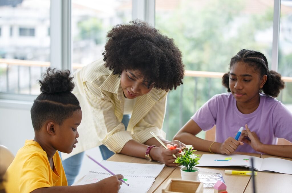 African American kids study with friends in class.